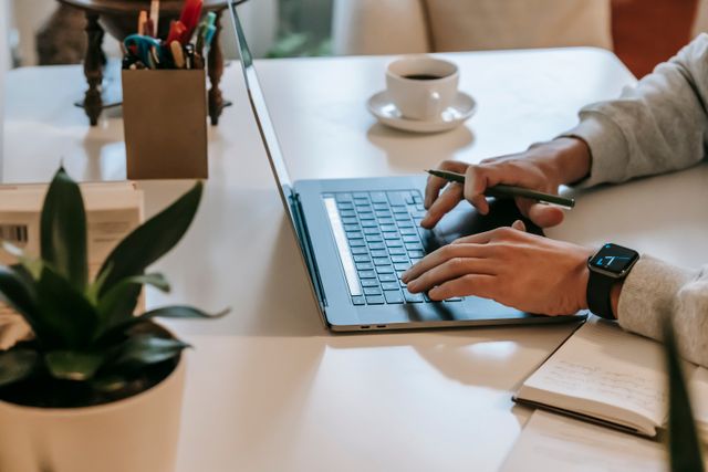 a person typing on a laptop